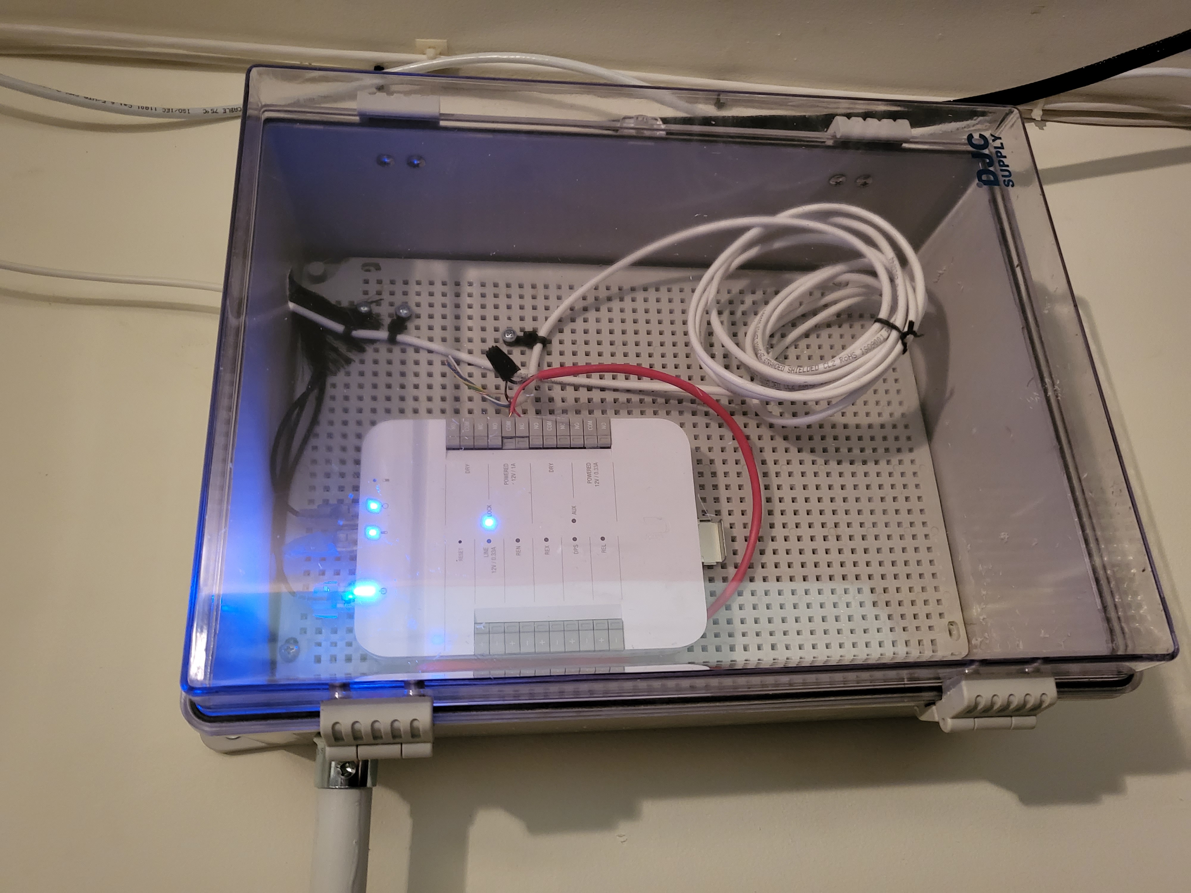 Door access control panel installed in a wall-mounted enclosure