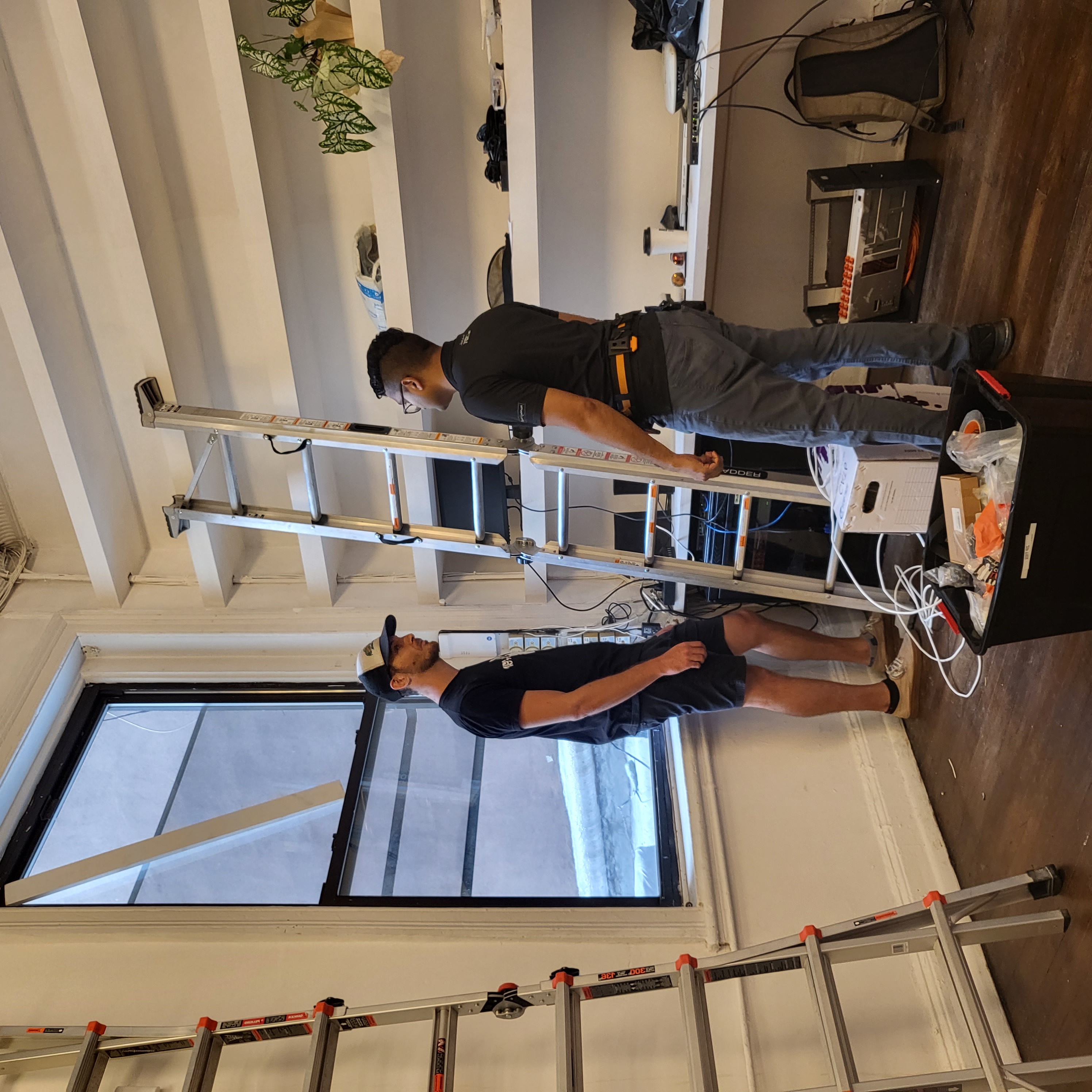 Prelinium technicians consulting on-site during a network installation